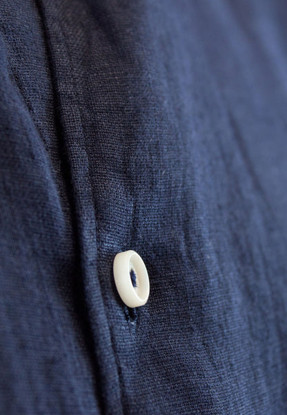 A navy blue linen shirt with a Mao collar, perfect for the hottest days of the year.